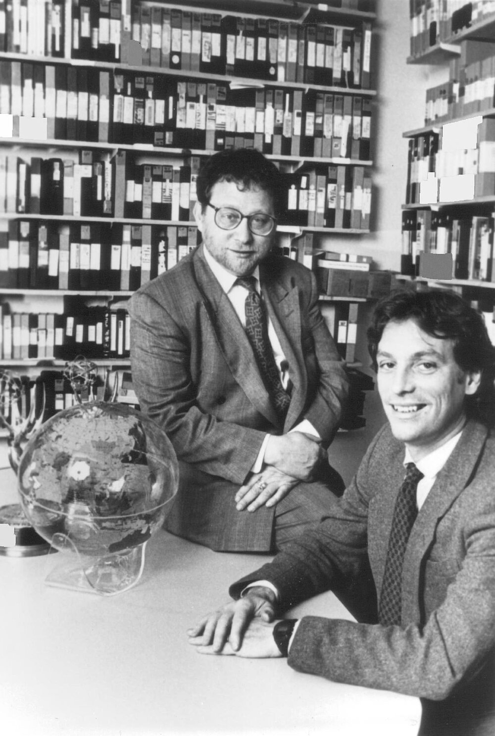 Rory O'Connor and Danny Schechter, co-founders of Globalvision, in the company's tape library