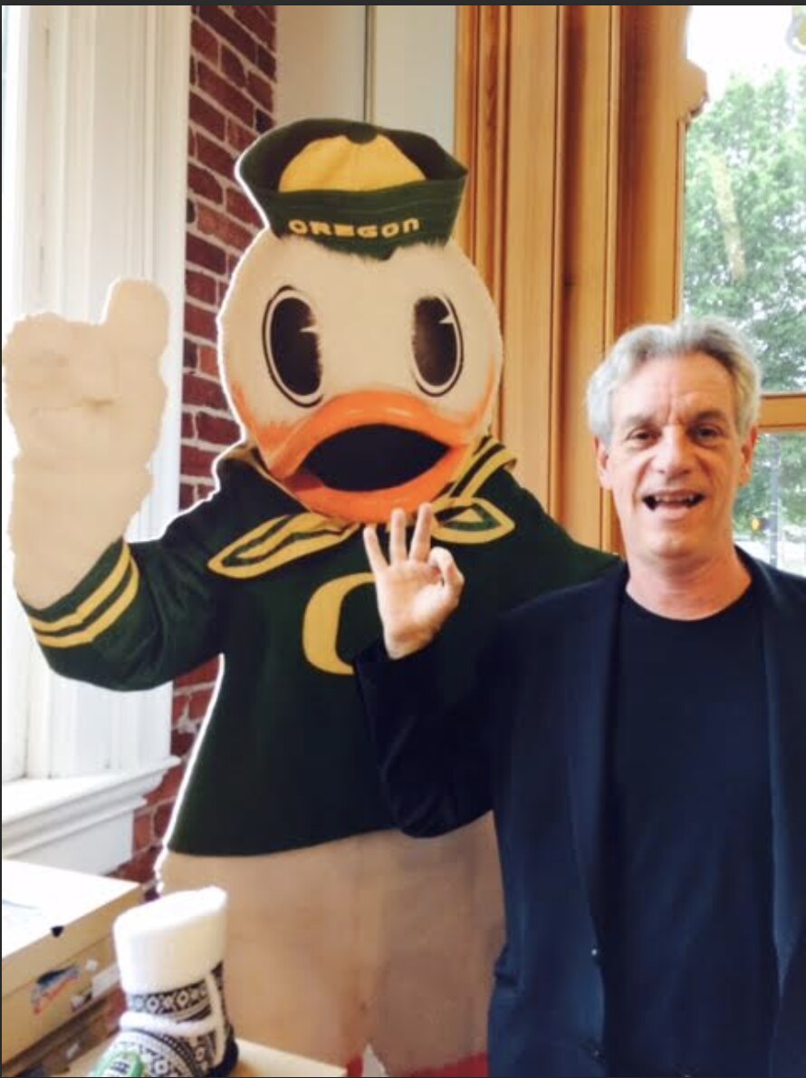 Rory O'Connor with the Oregon Ducks mascot at a campus visit