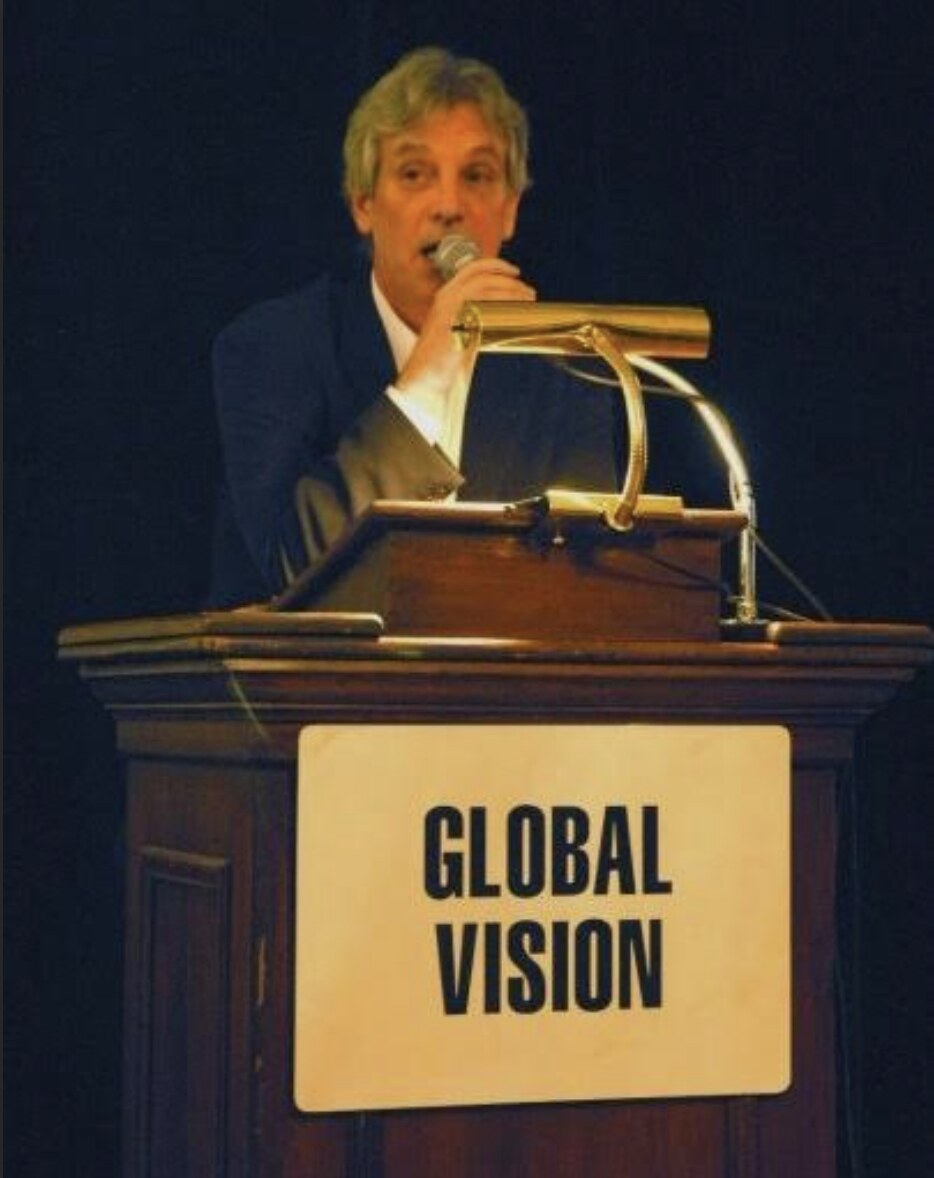 Rory O'Connor speaking at a Globalvision-branded podium